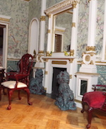 This oriental chinese room has statuary and oriental fire surround